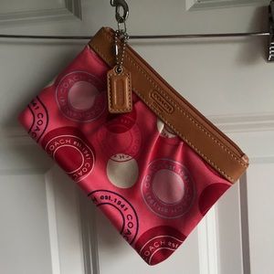 Coach “Signature Circles” Wristlet